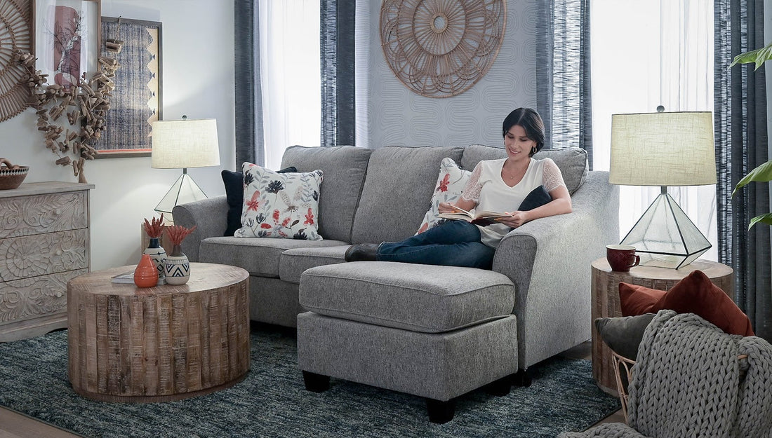 Woman sitting on a couch reading